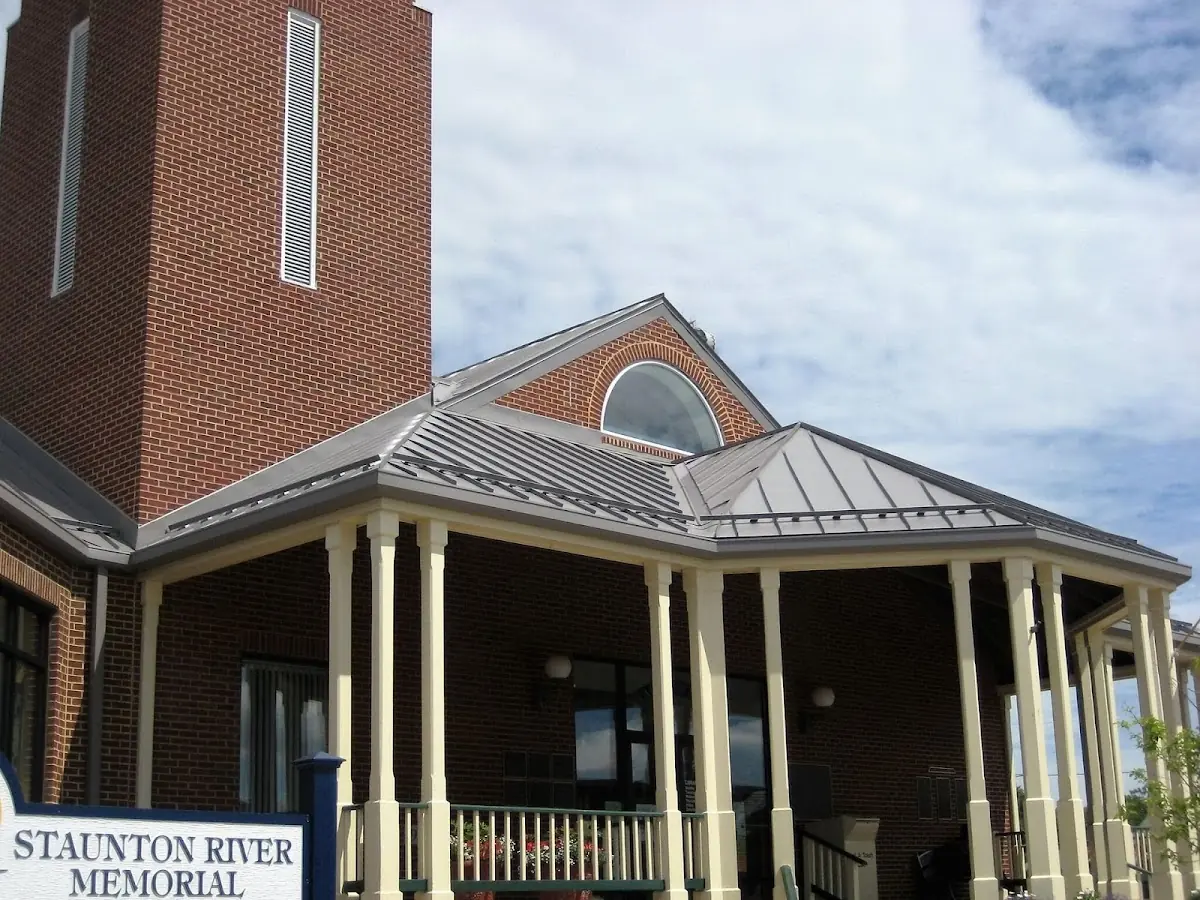 Skilled roofing craftsmen working on a residential roof in Calera